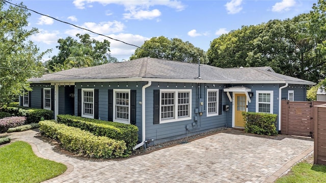 2312 S Summerlin Ave, Orlando, FL 32806 - ranch-style house with a shingled roof and a gate