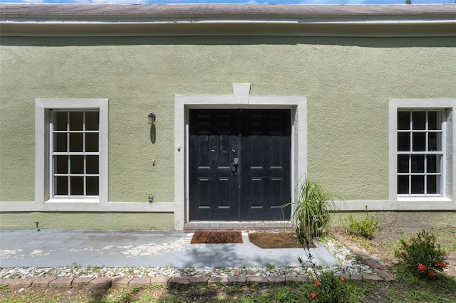 1065 Universal Rest Pl, Kissimmee, FL 34744 - property entrance featuring stucco siding