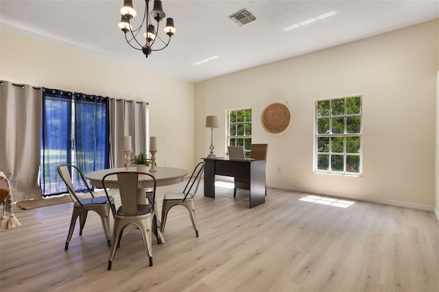 1065 Universal Rest Pl, Kissimmee, FL 34744 - dining area with wood finished floors and a chandelier