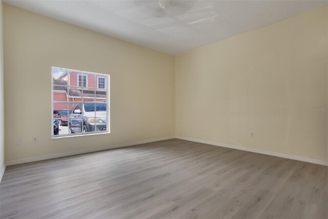 1065 Universal Rest Pl, Kissimmee, FL 34744 - unfurnished room featuring light wood finished floors and baseboards