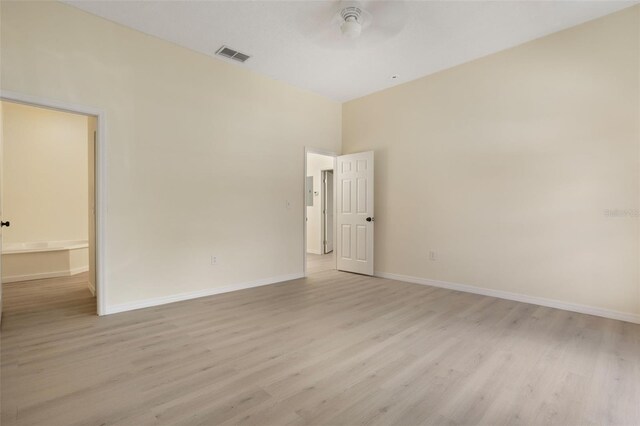 1065 Universal Rest Pl, Kissimmee, FL 34744 - empty room with light wood-style flooring, a high ceiling, and ceiling fan