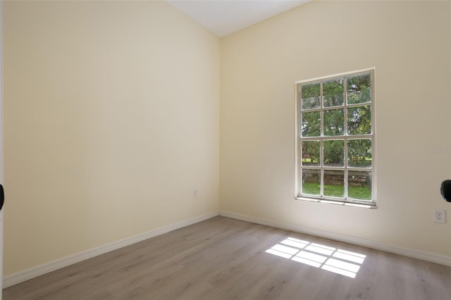 1065 Universal Rest Pl, Kissimmee, FL 34744 - spare room with wood finished floors and baseboards