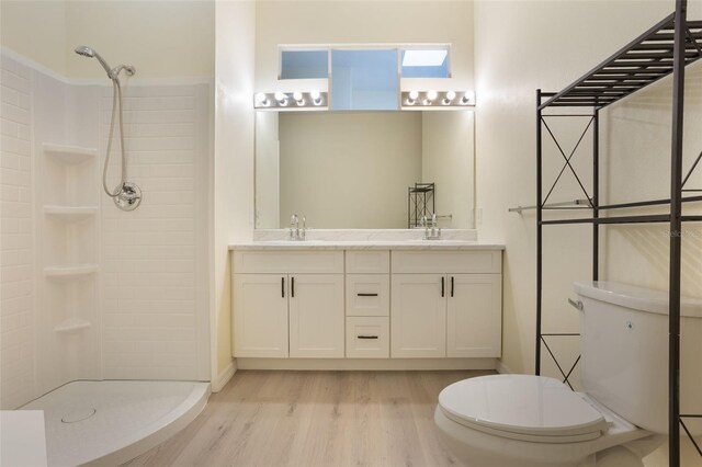 1065 Universal Rest Pl, Kissimmee, FL 34744 - full bath featuring wood finished floors, double vanity, and tiled shower