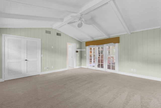 202 Riverview Dr, Longwood, FL 32779 - carpeted empty room featuring ceiling fan, french doors, and wood walls