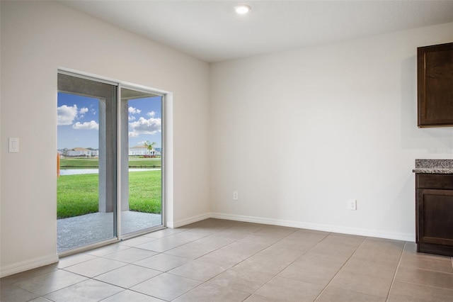 17127 Harvest Moon Way, Bradenton, FL 34211 - spare room featuring light tile patterned floors and baseboards