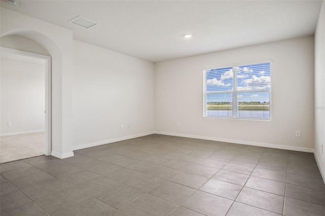 17127 Harvest Moon Way, Bradenton, FL 34211 - tiled empty room featuring baseboards and recessed lighting