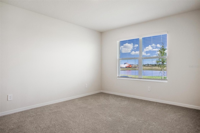 17127 Harvest Moon Way, Bradenton, FL 34211 - unfurnished room with carpet flooring and a water view