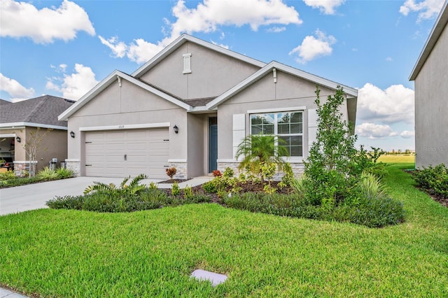 17127 Harvest Moon Way, Bradenton, FL 34211 - view of front of house featuring stone siding, stucco siding, an attached garage, driveway, and a front yard