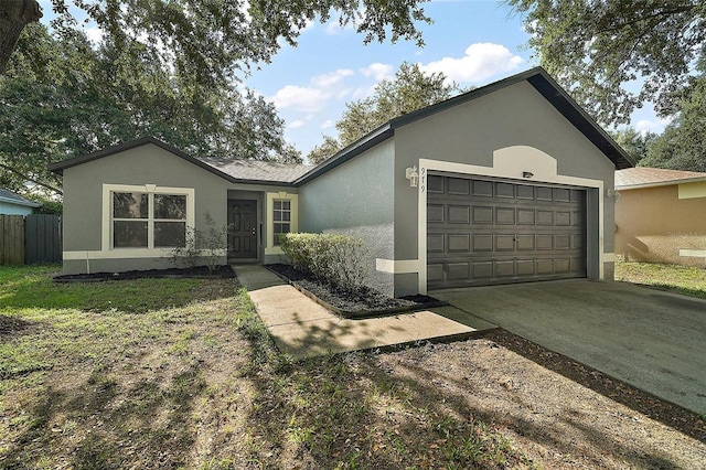 979 Mayfair St, Eustis, FL 32726 - single story home with stucco siding, a garage, and concrete driveway