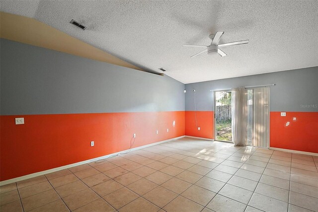 979 Mayfair St, Eustis, FL 32726 - unfurnished room with a ceiling fan, vaulted ceiling, a textured ceiling, and tile patterned flooring