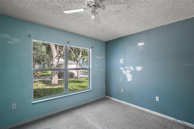 979 Mayfair St, Eustis, FL 32726 - empty room with a textured ceiling, ceiling fan, and carpet