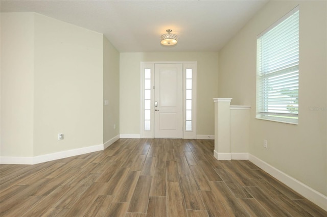 1222 Castlevecchio Loop, Orlando, FL 32825 - entrance foyer with wood finished floors and baseboards