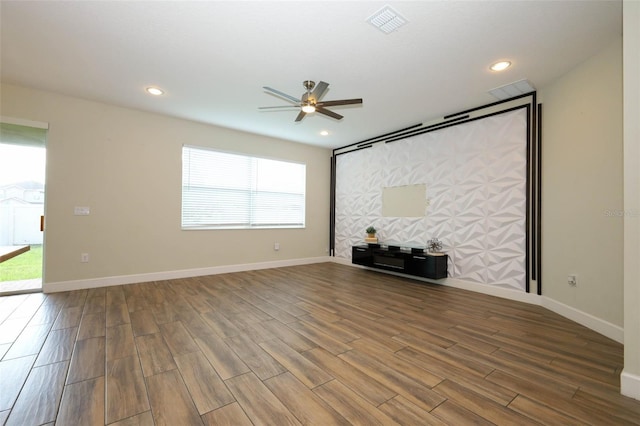 1222 Castlevecchio Loop, Orlando, FL 32825 - unfurnished living room featuring a ceiling fan, wood finished floors, and recessed lighting
