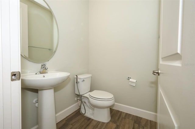 1222 Castlevecchio Loop, Orlando, FL 32825 - bathroom with baseboards and wood finished floors