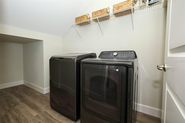 1222 Castlevecchio Loop, Orlando, FL 32825 - washroom featuring washing machine and dryer and wood finished floors