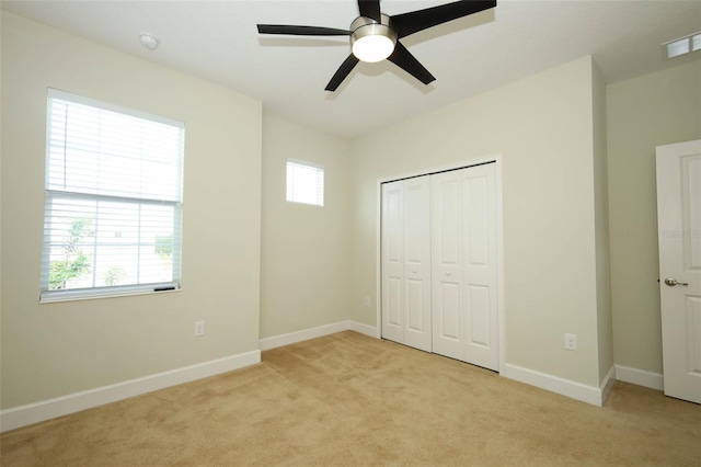 1222 Castlevecchio Loop, Orlando, FL 32825 - unfurnished bedroom featuring light carpet, a closet, and ceiling fan
