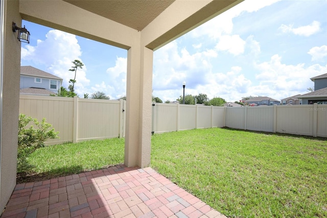 1222 Castlevecchio Loop, Orlando, FL 32825 - fenced backyard with a patio