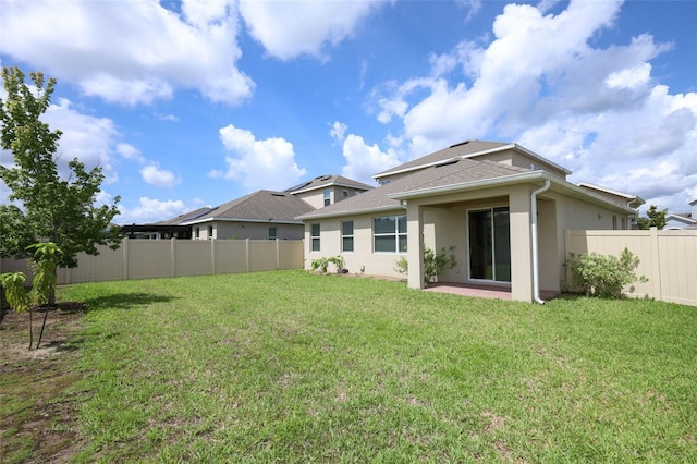 1222 Castlevecchio Loop, Orlando, FL 32825 - rear view of house with stucco siding