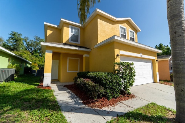 1129 Royal Ridge Dr, Davenport, FL 33896 - view of front facade featuring stucco siding, a garage, and concrete driveway