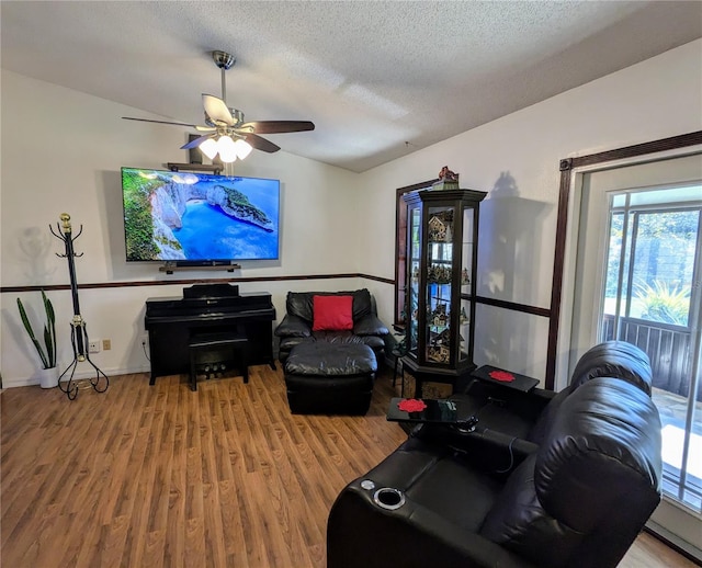 3021 Norvell Ct, Deltona, FL 32738 - living room featuring wood finished floors, a ceiling fan, and a textured ceiling