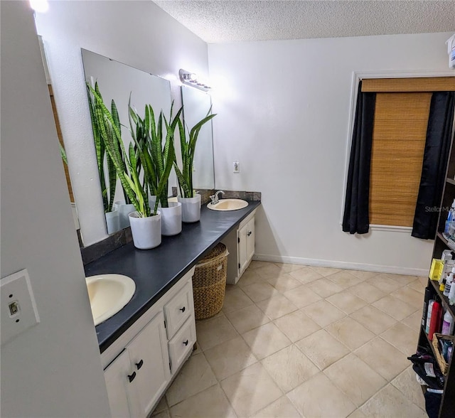 3021 Norvell Ct, Deltona, FL 32738 - full bathroom featuring double vanity, a textured ceiling, and tile patterned floors