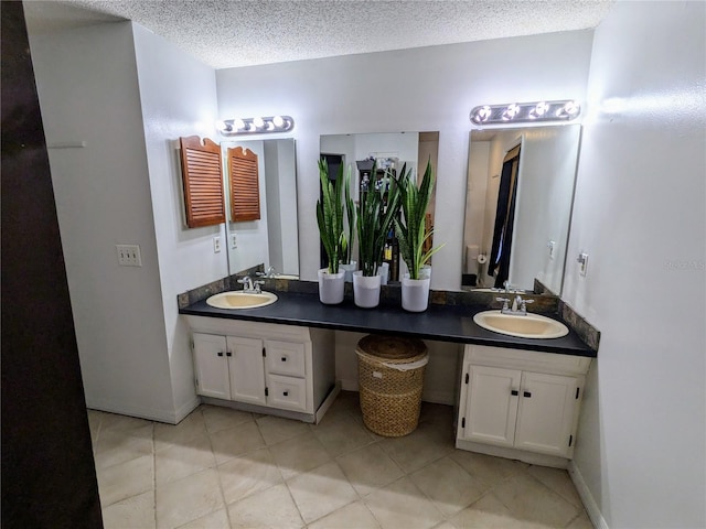 3021 Norvell Ct, Deltona, FL 32738 - bathroom with double vanity, tile patterned floors, and a textured ceiling