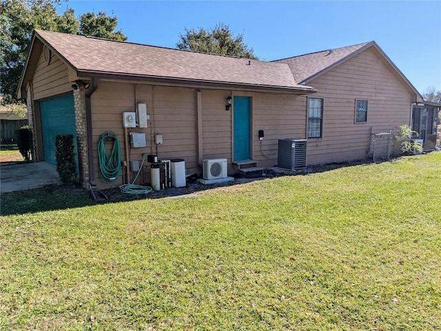 3021 Norvell Ct, Deltona, FL 32738 - rear view of property featuring a shingled roof, entry steps, and a garage