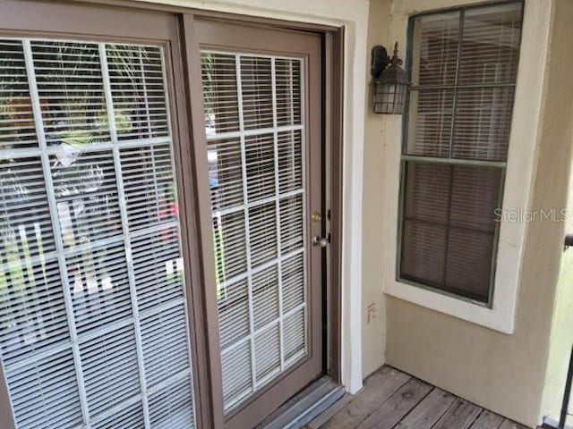 236 Afton Sq Unit 207, Altamonte Springs, FL 32714 - doorway to property featuring stucco siding