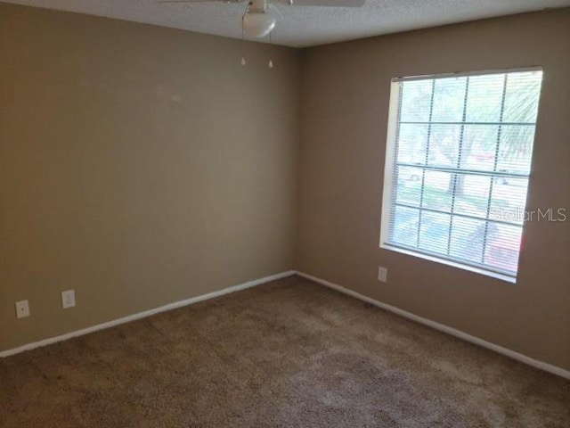 236 Afton Sq Unit 207, Altamonte Springs, FL 32714 - carpeted empty room featuring baseboards and ceiling fan