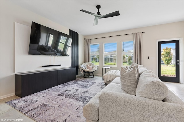 8955 Fluffy Lie Ct, Davenport, FL 33896 - living area with a ceiling fan and baseboards