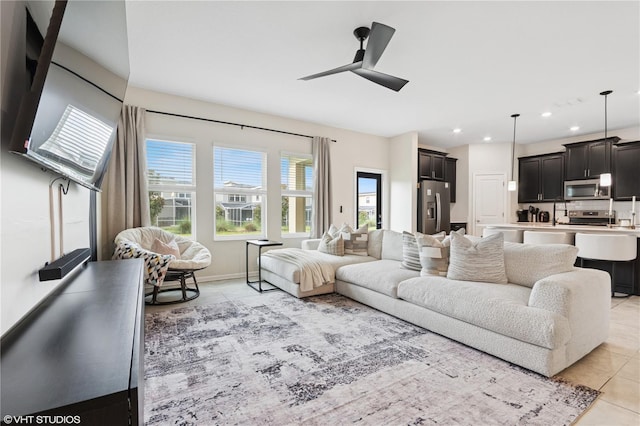 8955 Fluffy Lie Ct, Davenport, FL 33896 - living area with light tile patterned flooring, a ceiling fan, and recessed lighting