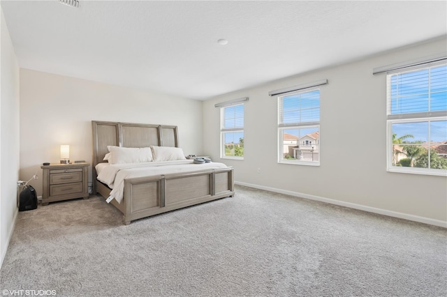 8955 Fluffy Lie Ct, Davenport, FL 33896 - carpeted bedroom with baseboards