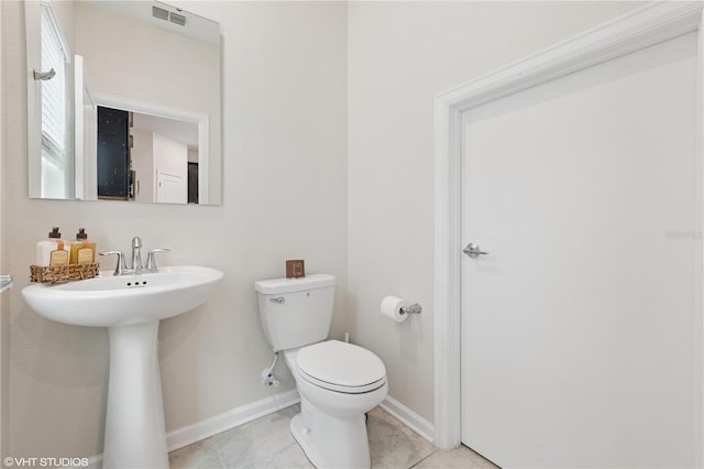 8955 Fluffy Lie Ct, Davenport, FL 33896 - bathroom with toilet and tile patterned floors