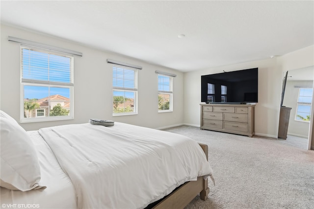 8955 Fluffy Lie Ct, Davenport, FL 33896 - bedroom with light carpet and baseboards