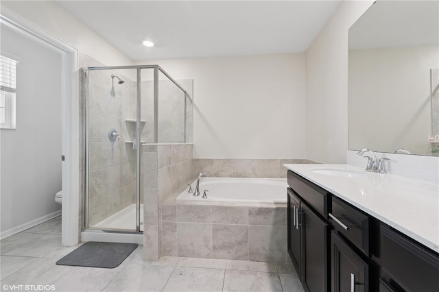 8955 Fluffy Lie Ct, Davenport, FL 33896 - bathroom featuring vanity, a garden tub, a shower stall, and tile patterned flooring