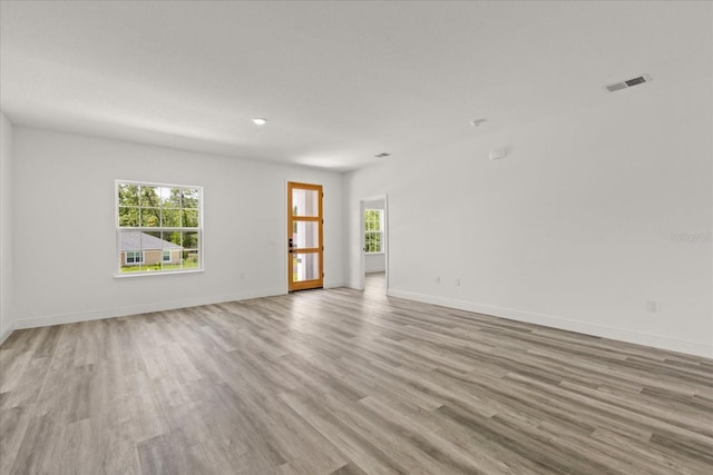 6421 SW 151st Loop, Ocala, FL 34473 - unfurnished room with plenty of natural light and light wood-type flooring