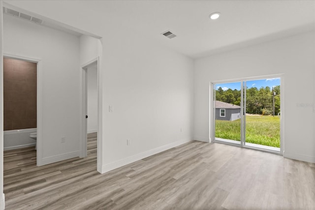 6421 SW 151st Loop, Ocala, FL 34473 - empty room with light wood-style floors and recessed lighting