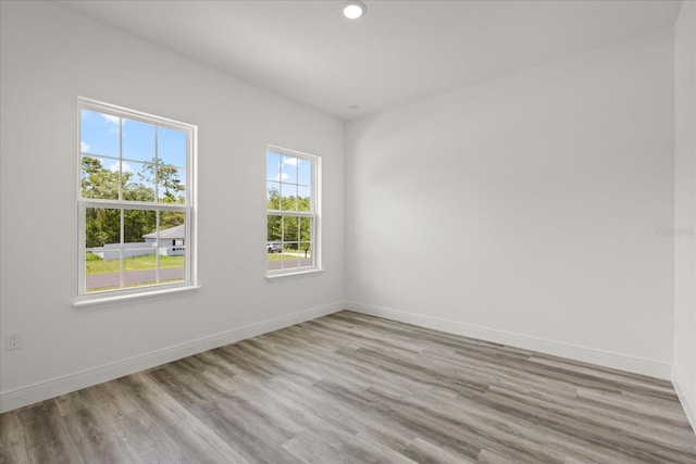 6421 SW 151st Loop, Ocala, FL 34473 - unfurnished room with wood finished floors and recessed lighting