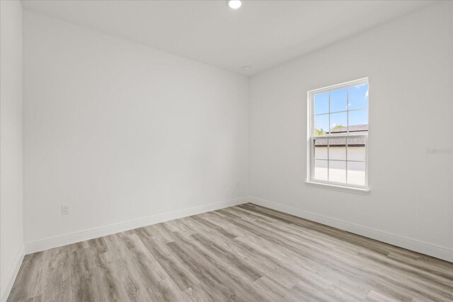 6421 SW 151st Loop, Ocala, FL 34473 - unfurnished room with wood finished floors and recessed lighting