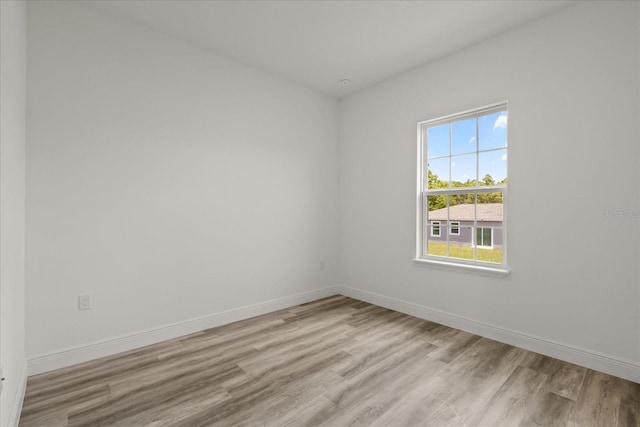6421 SW 151st Loop, Ocala, FL 34473 - empty room featuring wood finished floors and baseboards
