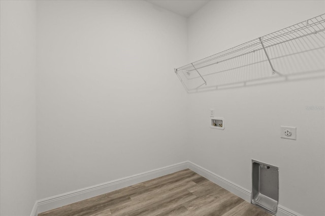 6421 SW 151st Loop, Ocala, FL 34473 - washroom featuring hookup for an electric dryer, hookup for a washing machine, and wood finished floors
