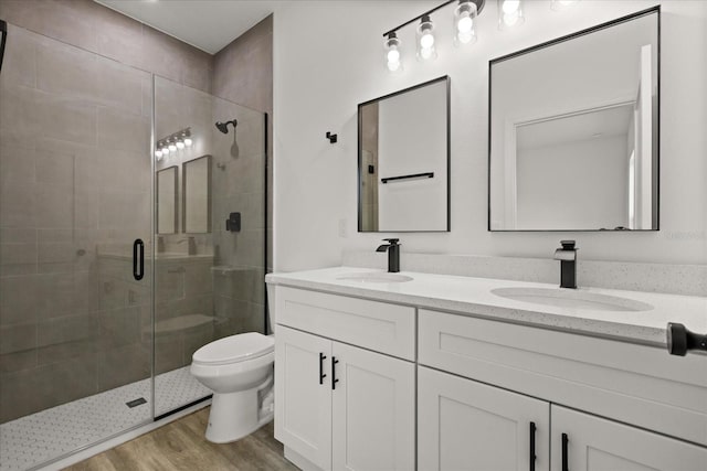 6421 SW 151st Loop, Ocala, FL 34473 - full bathroom featuring double vanity, a stall shower, and wood finished floors