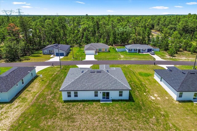 6421 SW 151st Loop, Ocala, FL 34473 - aerial view of residential area with a heavily wooded area