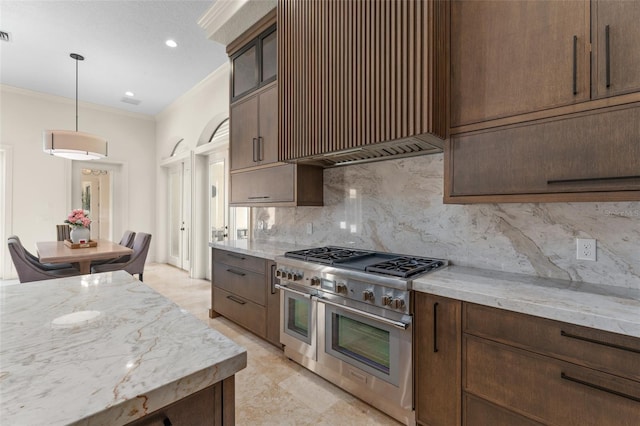 3426 Cocard Ct, Windermere, FL 34786 - kitchen featuring range with two ovens, premium range hood, tasteful backsplash, light stone countertops, and ornamental molding
