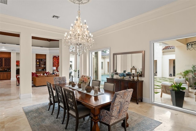 3426 Cocard Ct, Windermere, FL 34786 - dining room with crown molding, a chandelier, and light marble finish floors