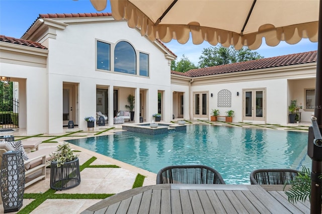 3426 Cocard Ct, Windermere, FL 34786 - view of pool featuring french doors, outdoor lounge area, a patio area, a pool with connected hot tub, and outdoor dining area