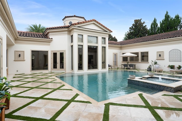 3426 Cocard Ct, Windermere, FL 34786 - view of swimming pool featuring french doors, a patio area, and a pool with connected hot tub