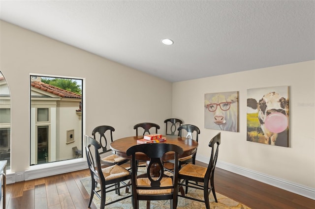 3426 Cocard Ct, Windermere, FL 34786 - dining space featuring dark wood-type flooring, recessed lighting, and a textured ceiling