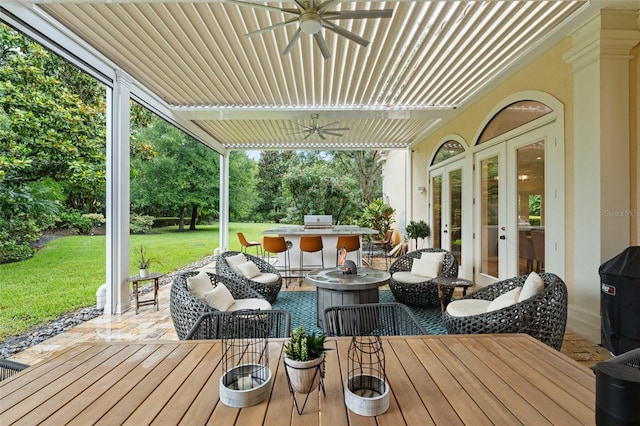 3426 Cocard Ct, Windermere, FL 34786 - wooden deck with french doors, a ceiling fan, a lawn, outdoor dining space, and outdoor lounge area