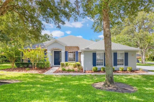 2782 Cedar Knoll Dr, Apopka, FL 32712 - view of front of house with a front lawn, stucco siding, and a shingled roof